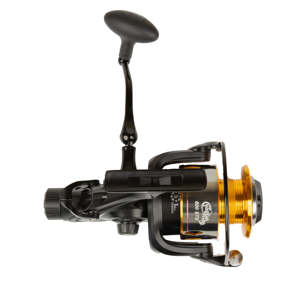 A close-up view of the Catfish Pro 600 STS spinning reel with the handle positioned upwards, showing its grip and robust construction.