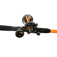 Close-up side view of the Catfish Pro Tournament Series 600 CTS reel attached to the rod, highlighting its black and gold design and precision craftsmanship.