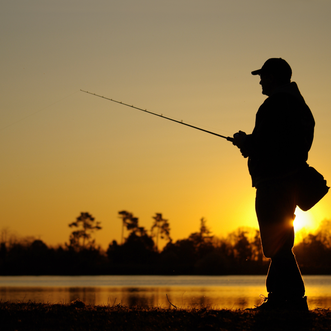 Man fishing during sun set