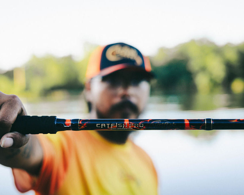 Man holding a fishing rod with a blurred background